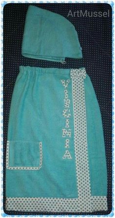 a blue towel with white polka dots on it and a black dot border around the edges