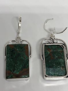 Antique vintage Green Chrysoprase Silver dangle earrings Delicate and detailed hand set vintage green chrysoprase Antique and Silver leverback earrings These dangle earrings are about an inch long All jewelry is shipped free in the US in a nice gift box. Check out our over a THOUSAND great reviews Can be converted to Clip on earrings add request Vintage Style Emerald Drop Earrings, Vintage Emerald Drop Earrings, Handmade Vintage Rectangular Earrings, Handmade Rectangular Vintage Earrings, Green Rectangular Earrings, Antique Green Drop Earrings, Vintage Emerald Earrings As Gift, Vintage Emerald Earrings For Gift, Green Bohemian Rectangular Earrings