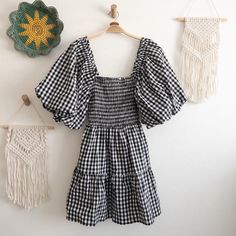 Introducing The Anthropologie Self Contrast Shirred Gingham Check Dress In Size Medium, Brand New With Tags. This Delightful Dress Is Made Of A Blend Of Cotton And Spandex And Is Designed To Be Machine-Washed In Cold Water And Tumble-Dried On Low. It Was Proudly Made In The Usa And Features Charming Elegant Puff Sleeves With Ruffle Trim And A Shirred Smocked Chest. The Knee-Length Skirt Is Tiered And Adorned With A Classic White And Black Gingham Check Pattern. This Dress Offers A Comfortable An Gingham Clothes, Black Gingham, Thanksgiving And Christmas, Check Dress, Gingham Check, Knee Length Skirt, Anthropologie Dress, Check Pattern, Classic White