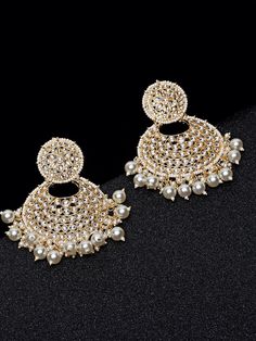 These exquisite gold-toned 2-layer crescent chandbali earrings come with kundan stone studs & beads, are gold-plated, and are secured with a post and back closure. These handcrafted chandbalis can be styled with any ethnic outfit for a dramatic impact, or an evening outfit to complete a dazzling look. Eitherway, complements are all yours! Product color may vary based on the monitor or screen you are using.See FAQ for more details. Size Length: 8.5 cm Details Material: BrassStones: Kundan & Artif Festive Chandbalis Drop Earrings For Pierced Ears, Pearl Drop Chandbalis For Diwali Reception, Pearl Drop Chandbalis For Reception And Diwali, Gold Round Chandbalis With Stone Work, Gold Stone Work Round Chandbalis, Metal Chandbalis For Celebration, Festive Kundan Chandelier Earrings For Pierced Ears, Gold Chandbali Danglers With Stone Work, Kundan Chandbali Bridal Earrings