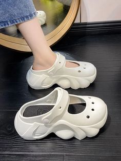 Hollow Crocs Sandals Casual White Closed Toe Jelly Sandals, White Closed Toe Jelly Sandals For Summer, Comfortable White Jelly Sandals For Summer, White Eva Sandals With Round Toe, White Flat Heel Jelly Sandals For Summer, White Round Toe Jelly Sandals For Spring, White Eva Sandals For Spring, White Jelly Sandals With Round Toe For Spring, White Flat Sandals With Eva Material