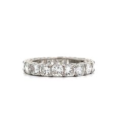 This eternity band challenges the ordinary, wrapping your finger in a continuous loop of cushion cut diamonds set in sleek platinum. The shared prong setting keeps each G color, VS2 clarity stone in the spotlight, creating a line of brilliance that feels both daring and deliberate. With 3.85 carats of diamonds, this ring isn’t just about sparkle—it’s about the audacity of wearing a piece that refuses to be background noise. Whether paired with an engagement ring or standing on its own, this band Classic White Gold Eternity Band With Asscher Cut, White Asscher Cut Eternity Band With Diamond Cut, Classic Asscher Cut Diamond White Eternity Band, Cubic Zirconia Eternity Band With Asscher Cut Prong Setting, Classic Asscher Cut Cubic Zirconia Eternity Band, Radiant Cut Eternity Band With Prong Setting, Classic White Gold Eternity Band With Radiant Cut, Asscher Cut Diamond Eternity Band With Brilliant Cut, Asscher Cut Diamond Eternity Band With Prong Setting