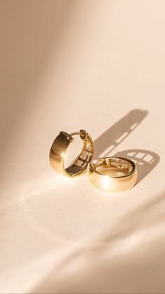 Golden Moment. ✨An updated take on a classic look, these wide huggie hoop earrings are perfect for chic, everyday wear. #brilliantearth #gold #goldearrings #goldjewelry #hoops #huggiehoops #goldhoops #trending #jewelrytrends #2021 #vday #gifts #giftsforher #valentinesday #necklace #bracelet #finejewelry 14k Gold Huggie Hoop Earrings, Timeless 14k Gold Huggie Earrings For Formal Occasions, Fine Jewelry Polished Huggie Earrings, Timeless Huggie Earrings For Everyday Luxury, Classic 14k Gold Pierced Huggie Earrings, Luxury Everyday Huggie Hoop Earrings, Polished Finish Huggie Earrings In Fine Jewelry, Classic Yellow Gold Pierced Huggie Earrings, Formal 14k Gold Timeless Huggie Earrings