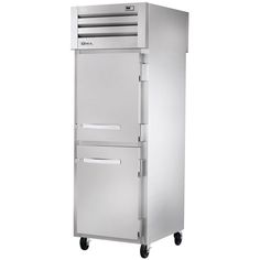 a large stainless steel freezer sitting on wheels