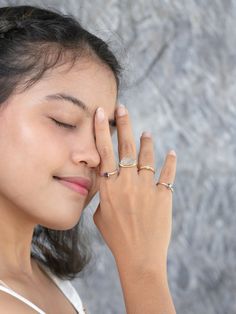 The color of the mystical dusk. Featuring a 0.91 ct deep purple diamond, hugged in a stardust-finished band. Made by hand in ethical rose gold. Details 18 karat rose gold Our signature ethical gold: mercury free and mined by indigenous women who receive fair pay Spinel from Sri Lanka August birthstone Purple Spinel Ring in Ethical Rose Gold The color of the morning dusk when the sky turns light with purple in hindsight. This ethical rose gold ring features a 0.91 ct deep purple spinel, hugged in Rose Gold Sapphire Promise Ring In Minimalist Style, Minimalist Rose Gold Sapphire Promise Ring, Minimalist Rose Gold Sapphire Ring, Rose Gold Ethical Diamond Promise Ring, Celestial Rose Gold Promise Rings, Rose Gold Halo Sapphire Promise Ring, Celestial Rose Gold Gemstone Rings, Rose Gold Band Ring, Ethical Engagement Ring