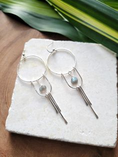 The Solstice Earrings in Moonstone have been a top seller that I decided to design them with Labradorite as well! These beauties are light weight and you can wear them as an everyday earring or take them out on a special night. They are very versatile. Each piece is handmade with your choice of 14K Gold Filled or Sterling Silver. The length of the earrings are just over 3 in. Labradorite is a natural stone and the color may slightly vary. You can see the colors in the 4th picture. Thank you for Dangle Earrings With Amazonite And Natural Stones, Adjustable Labradorite Dangle Earrings, Adjustable Round Labradorite Earrings, Adjustable Dangle Labradorite Earrings, Handmade Labradorite Earrings For Everyday, Bohemian Gemstone Earrings For Everyday, Bohemian Everyday Gemstone Earrings, Modern Moonstone Drop Earrings, Handmade Minimalist Labradorite Earrings