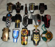 there are many different types of toy cars on the bed together, including one that is black and gold