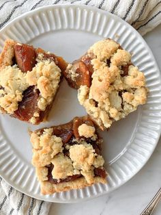 three pieces of dessert on a white plate