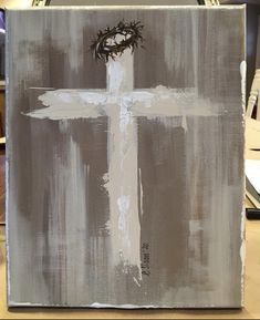 a painting with a cross on it and a crown of thorns above the cross