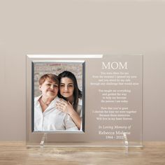 an acrylic photo frame with the words, mom and two children on it