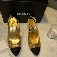 This Is An Authentic Pair Of Chanel Grosgrain Cap Toe Cc Slingback Pumps Size 38 In Black And Gold. These Chic Slingback Pumps Are Crafted Of Glitter Fabric With A Black Grosgrain Cap Toe And Gold Hardware. Chanel Heels, Chanel Slingback, Shoes Chanel, Wrap Shoes, Gold Chanel, Slingback Heels, Dior Handbags, Ankle Wrap, Gorgeous Shoes