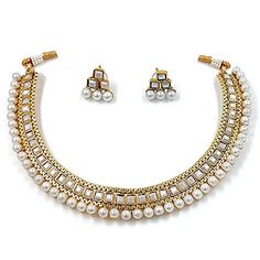 PRICES MAY VARY. Product Dimension :Necklace Length - 4.3 inch x Width - 0.6 inch, Earrings Height - 0.6 inch x Width - 0.5 inch, Weight - 32.23 gms Occasion: Take your style up a notch with this handcrafted piece of jewellery; Enamelled and embellished with rhinestone, crystal, faux pearl, it is perfect for a traditional yet contemporary look Outfits: Ideal for any ethnic outfits like sarees, lehengas, gowns, bridal wear or for parties, festivals, dance or any special occasion or as fashion cos Choker Necklace Indian, Bridal Choker Necklace, White Choker Necklace, Indian Choker Necklace, White Choker, Heritage Jewellery, Face Jewels, Bridal Choker, Necklace Indian