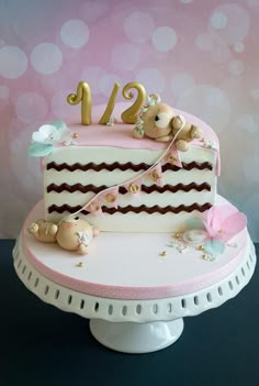 a pink and white cake with the number twenty one on it