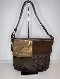 Vintage Coach 10421 Brown Patchwork Crossbody Bag. Vintage pre-owned condition with signs of use. Has scuffs and marks. Please see description, measurements and photos for details. Brass tone metal, Coach leather hangtag charm with Top zipper closure. “ gold patches on one side does Interior: Zipper pocket. two open pockets and D ring Measurements approximate: 10" H X 10" at top zipper area L X 3" D Strap drop adjustable / removable: Crossbody about 20" Shoulder about 9" Coach Shoulder Bag With Adjustable Strap For Fall, Fall Coach Shoulder Bag With Zipper Pocket, Coach Crossbody Shoulder Bag, Coach Crossbody Shoulder Bag With Zipper Closure, Coach Crossbody Shoulder Bag With Zipper, Coach Crossbody Hobo Bag With Zipper Closure, Coach Square Shoulder Bag For Everyday Use, Coach Satchel Shoulder Bag With Zipper Pocket, Coach Brown Shoulder Bag For Fall