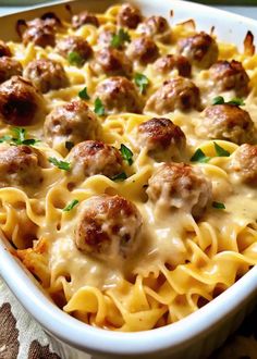 a casserole dish filled with meatballs and cheese