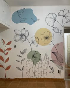 a wall with flowers painted on it