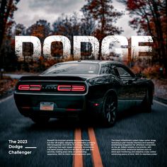 a black sports car driving down a road with the word dodge on it's side