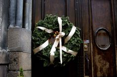 a wreath on the front door of a building