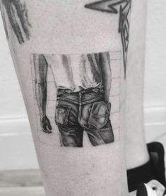 a black and white photo on the leg of a man