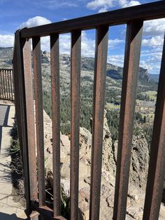 a metal railing on the side of a mountain