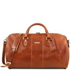 Leather Luggage Weekender Duffles bags Lisbona Travel leather duffle bag - Large size Honey TL141657. Soft structure, Full grain vegetable tanned leather hand-buffered, 1 compartment Honey Discover how to customize your bag and make it unique. Shop online and save money. 30-Day Money-Back Guarantee! Leather Duffel Bag, Leather Factory, Leather Duffel, Sac Week End, Leather Duffle Bag, Leather Travel Bag, Leather Duffle, Duffel Bags, Leather Luggage