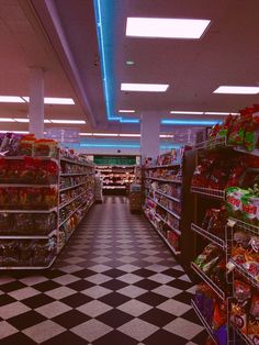 an empty grocery store aisle with shelves full of food