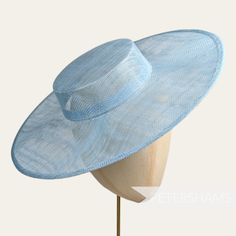 *This is not a fitted hat! You will need to attach a headband, comb or elastic to secure it to your head* Boaters are all the rage, and this light blue sinamay fascinator version has us all in a twirl!  Made from 2 layers of stiffened sinamay, these boaters are ready to trim and have a petersham ribbon on it's inside edge. Simply add a comb or headband to secure to the head. Hat base measures: Width: 37cm (14.5 inches) Crown Width: Measures 15.5cm (6.1 inches) wide at base and 14cm (5.5 inches) Fitted Sinamay Boater Hat With Curved Brim, Fitted Hat With Round Crown For Kentucky Derby, Fitted Sinamay Boater Hat With Flat Brim, Adjustable Curved Brim Boater Hat For Church, Fitted Sinamay Boater Hat With Short Brim, Adjustable Sinamay Boater Hat For Royal Ascot, Adjustable Hat With Round Crown For Summer, Fitted Sinamay Brimmed Top Hat, Adjustable Blue Sinamay Fascinator