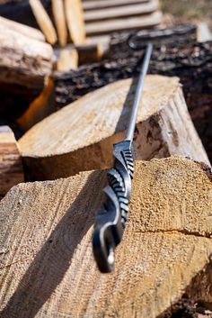 a knife that is sitting on some wood