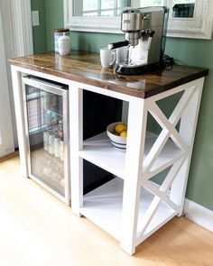 a kitchen island made out of an old cabinet with a glass door on the front