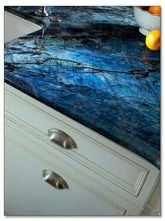 a kitchen counter with blue marble on it