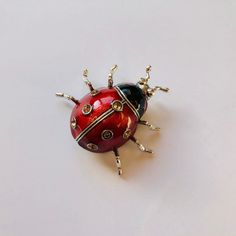 Red enamel ladybug rhinestone brooch. Sparkly and cute. Not intended for children ages 13 and under. Also, for many items we can accommodate large orders, so please send us a message. Red Enamel Pins For Gifts, Silver Novelty Brooches For Gifts, Red Enamel Brooch Pin For Gift, Red Enamel Brooch Gift, Red Enamel Brooch For Gift, Red Enamel Brooches As Gift, Red Enamel Brooches For Gift, Bug Pins, Ladybug Brooch