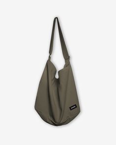 This vintage inspired high capacity tsuno bag is made from 100% cotton canvas material and features a slouchy fit. It features a large pocket with zip closure and interior open pockets. It is perfect to wear over the shoulder or across your body and can fit all your everyday essentials. 100% Cotton Adjustable strap One-size Everyday Khaki Cotton Shoulder Bag, Large Capacity Khaki Cotton Shoulder Bag, Khaki Cotton Shoulder Bag For Daily Use, Casual Khaki Hobo Bag For Everyday, Casual Everyday Khaki Hobo Bag, Cotton Hobo Bag With Pockets, Cotton Hobo Bag With Pockets For Daily Use, Everyday Khaki Shoulder Bag With Zipper Pocket, Casual Shoulder Bag With Pockets For Weekend