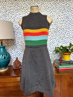 Authentic 1970s knit dress Young East brand size 11 50% acrylic 50% polyester Yellow, orange, blue and green stripes below bust Sleepless Excellent vintage condition, no visible flaws Some stretch in bust due to the knit fabric of the dress Bust: 12" Waist: 12" Length: 35" (from neckline) Thank you so much for checking out this dress! Please message me with any questions because I want to assure your satisfaction. Please note that the item is vintage and does have wear inherent to the age of the item. I do my best to list and notate any condition issues or imperfections. I do not accept returns at this time.  Items are measured with the garment laying flat. Williamsburg Va, Striped Knit Dress, 1960s Fashion, Dress Vintage, Striped Knit, Green Stripes, Dress Clothes For Women, Yellow Orange, Blue And Green