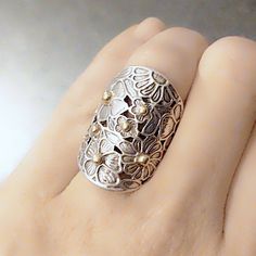 Beautiful Vintage Sterling Silver & 14k Gold Floral Ring- Size 6. Looks Like John Hardy, But I Can't Make Out The Hallmark. Please Advise If You Recognize It! Thank You! Sterling Silver Jewelry With Silver Accents For Gifts, Handmade Silver Flower Ring In Fine Jewelry Style, Handmade Silver Flower Ring Fine Jewelry, Silver Filigree Flower Ring For Anniversary, Elegant Hallmarked Silver Flower Ring, Elegant Silver Flower Ring Hallmarked, Elegant Silver Hallmarked Flower Ring, Elegant Silver Flower Ring, Hallmarked, Silver Flower Ring With Intricate Design For Anniversary