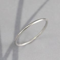 Platinum Band Spacer Ring 1.25mm Full Round Band Platinum Ring Platinum Wedding Band Platinum Wedding Ring Platinum Stacking Ring This is the perfect spacer ring or petite wedding band! Hand made from 16 gauge (1.25mm) full round material, it is sturdy while maintaining a slim profile. Your ring will be handmade to size just for you and can have either a high polished finish or soft matte brushed finish. Platinum is 30 times more rare than gold. It takes special skill and training to properly wo Simple Stackable White Gold Rings, White Gold Wedding Band With Simple Design, Simple Stackable Round Band Wedding Rings, Simple Stackable Wedding Rings With Round Band, White Gold Stackable Rings For Wedding, Simple Polished Stackable Wedding Rings, Minimalist Stackable Rings With Halo Detail, Simple White Gold Stackable Wedding Rings, Sterling Silver Stackable Rings With Halo