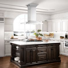 a kitchen with white cabinets and an island in the middle of the room, surrounded by wood flooring