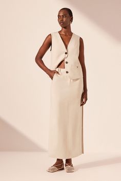 Chic Beige Maxi Dress With Side Slits, Chic Workwear Maxi Skirt With Side Slits, Chic Midi Skirt With Split Design, Beige Maxi Dress With Side Slits, Chic Spring Maxi Skirt With Split Design, Chic Maxi Skirt With Split Design For Spring, Elegant Beige Asymmetrical Maxi Skirt, Spring Maxi Skirt With Side Slits For Work, Chic Wide Leg Maxi Skirt With Side Slits