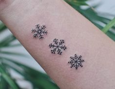 three small snowflakes on the arm