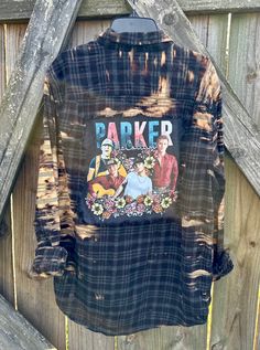 This awesome PARKER MCCOLLUM distressed, one of a kind, long sleeve, size MEDIUM flannel is perfect for any PARKER MCCOLLUM fan. There is two pockets on the front, buttons up and is long sleeve. On the back of the shirt is a PARKER MCCOLLUM tee that has been sewn into the flannel. The flannel is frayed around the tee giving it a distressed/vintage/tattered look.  Upcycled/Distressed Long Sleeve Size Medium 100% Cotton Button Up All my shirts are a ONE OF A KIND. They are all upcycled and previously owned so there will be signs of wear and tear. But this is what make each one unique in its own way and for sure makes them the most comfortable.  Here are some ways you can style your shirt.  1) wear cowboy boots or tennis      shoes 2) wear it with jeans or shorts  3) wear tank or shirt undern Grunge Long Sleeve Shirt For Fall, Distressed Long Sleeve Shirt For Fall, Grunge Cotton Shirt For Fall, Grunge Relaxed Fit Shirt For Fall, Relaxed Fit Grunge Shirt For Fall, Distressed Cotton Shirt For Fall, Distressed Relaxed Fit Shirt For Fall, Fall Relaxed Fit Pre-washed Shirt, Distressed Button-up Shirt For Fall