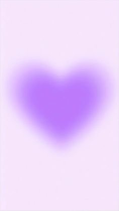 a purple heart shaped object is shown in the middle of a white background with an overexposed image