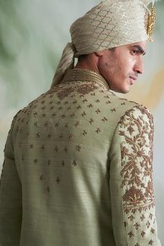 Mint green sherwani with floral embroidered thread work. Paired with cotton silk kurta, churidar pant.
Components:3
Pattern:Embroidered
Type of Work:Thread work
Neckline:Mandarin collar
Sleeve Length:Full sleeves
Fabric:Raw silk, Cotton silk
Color:Green
Other Details:
Concealed placket
Note: Safa worn by the model is not for sale
Occasion:Wedding,Groom  - Aza Fashions Green Raw Silk Straight Kurta Bandhgala, Designer Green Raw Silk Bandhgala, Green Raw Silk Designer Bandhgala, Designer Pista Green Sherwani With Chikankari Embroidery, Festive Green Raw Silk Bandhgala, Festive Green Nehru Jacket With Intricate Embroidery, Green Sherwani With Zari Work Straight Kurta, Green Sherwani With Zari Work, Straight Kurta Style, Green Sherwani With Zari Work