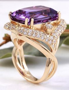 13.50 Carats Natural Amethyst and Diamond 14K Solid Yellow Gold Ring Suggested Replacement Value: $7,400.00 Total Natural Cushion Shaped Amethyst Weights: Approx. 12.00 Carats Amethyst Measures: 17.00 x 13mm Natural Round Diamonds Weight: Approx. 1.50 Carats (color G-H / Clarity SI1-SI2) Ring size: 7 (free re-sizing available) Ring total weight: Approx. 12.00 grams Disclaimer: all weights, measurements and colors are approximate and may vary slightly from the listed dimensions or as seen in the Luxury Purple 14k Gold Rings, Elegant Yellow Gold Amethyst Ring With Accent Stones, Luxury 14k Gold Purple Rings, Elegant Gold Amethyst Ring With Diamonds, Luxury Purple Jewelry For Wedding, Luxury Purple 14k Gold Jewelry, Elegant Purple Diamond Ring With Gemstone Accents, Luxury 14k Gold Purple Jewelry, Luxury Amethyst Rings With Gemstone Accents