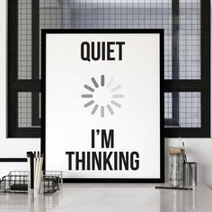 a poster with the words quiet i'm thinking in black and white on it