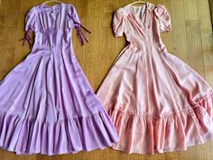 FREE SHIPPING! These two stunning dresses came from the same estate and are in overall wonderful condition. These both have been dry, cleaned and ready to wear. The purple has one small stain on the skirt as shown. The purple dress has purple velvet ribbons that tie on the sleeve and has a full button back. The peach dress has snap side closure. We have a seven day return policy on all of our clothing. Both dresses are 17 inches across the bust, 12 1/2 inches on the waist for the peach dress and 13 1/2" for the purple and both are 53" long. Purple 1800s Dress, Vintage Purple Maxi Dress, Purple 70s Dress, 60s Purple Dress, Long Ball Gown, 1930s Purple Dress, 30s Dress, Ball Gown Dress, Flapper Girl