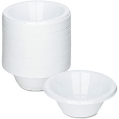 a stack of white bowls sitting next to each other