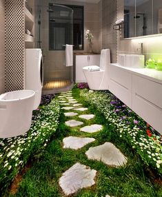 an image of a bathroom with flowers on the floor and green grass in the middle