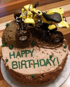 a birthday cake with a dirt bike on top