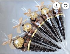 chocolate candies wrapped in cellophane and tied with gold ribbon