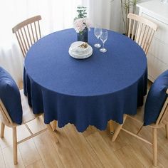 a blue table with four chairs around it