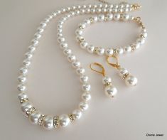 "This vintage inspired gold finish set comes with necklace, bracelet and earrings. Swarovski pearls in your color of preference. Makes a perfect gift for you, bridesmaids, maid of honor, mother of the bride or just for someone special! If you need a different color pearl contact me to check availability. Perfect for any classy bride! Necklace, This classic and elegant necklace has graduated Swarovski pearls. Pearls in the front of the necklace measure 10 mm and are separated with rhinestone roun Wedding Necklace Pearl, Flower Girl Jewelry Set, Fall Wedding Jewelry, Classy Bride, Rose Gold Bridal Jewelry, Blue Bridal Earrings, Bride Jewelry Set, Bride Necklace, Wedding Jewelry Set